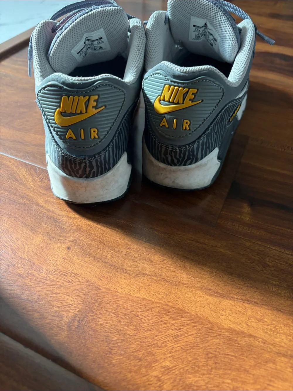 Nike Gray Sneakers with Pink Logo and Yellow Outsole